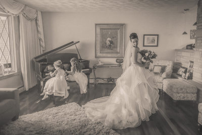 buffalo bride with flower girls in dresses playing piano