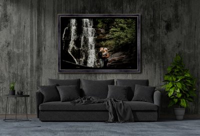 living room concrete wall with black sofa in darkness at night in a home interior. 3d Rendering