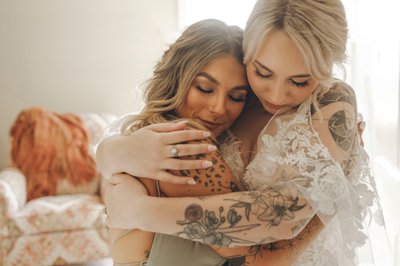 Brides Intimate Embrace with her Bridesmaid