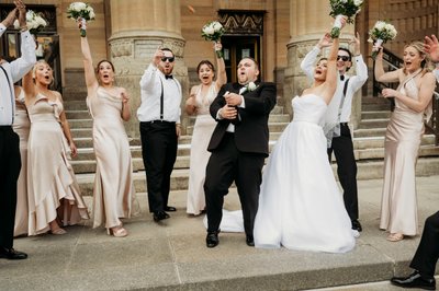 Groom Popping Champagne at Buffalo City Hall