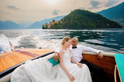 Bride & Groom Enjoying a Boat Ride At Lake Como Wedding