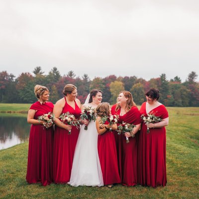 Stunning red bridesmaids dress at fall wedding