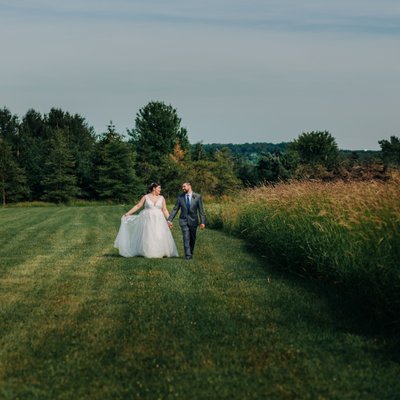 newlyweds stroll in the gorgeous countryside