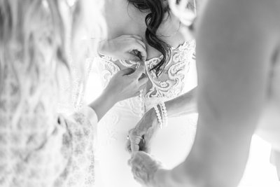 bride getting into dress