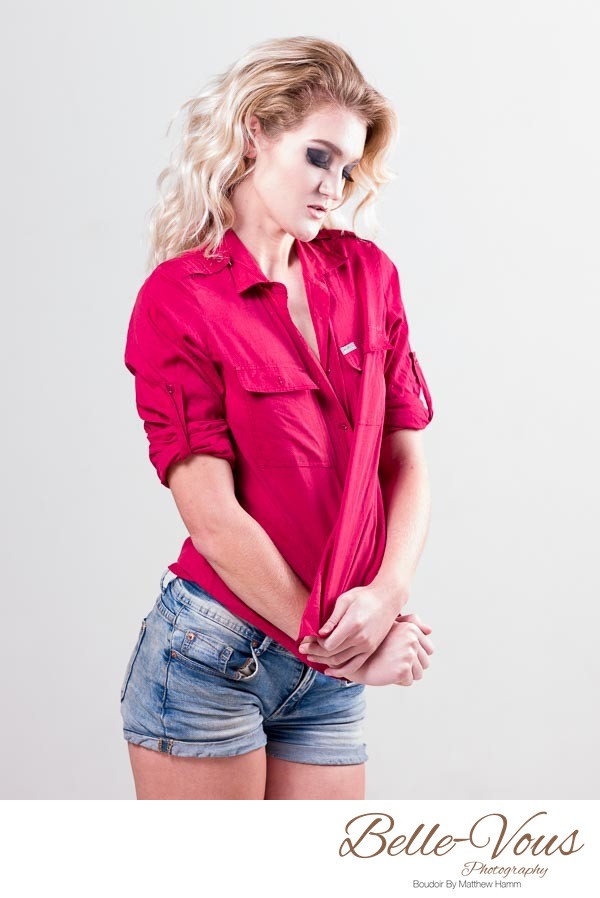 Female Model In Red Top On White Studio Background