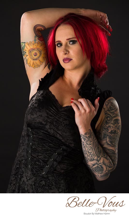 Inked Model With Red Hair Wearing Goth Black Dress