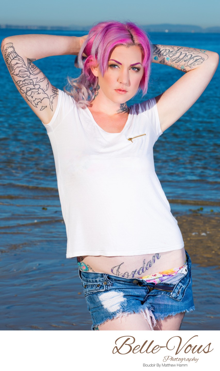 Model With Pink Hair Posing Next To Water