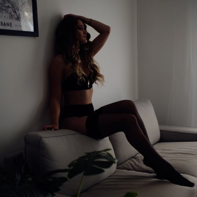 Boudoir Photo Of Woman On A Grey Lounge