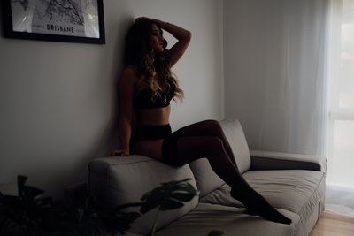 Boudoir Photo Of Woman On A Grey Lounge