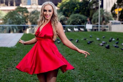 Spinning Model Wearing Red Dress on Grass