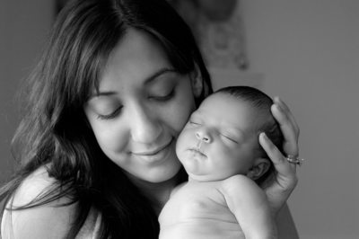 Joyous Mom and Newborn in Black and White