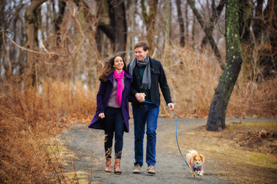Engaged Couple Walking with Dog in Sweater