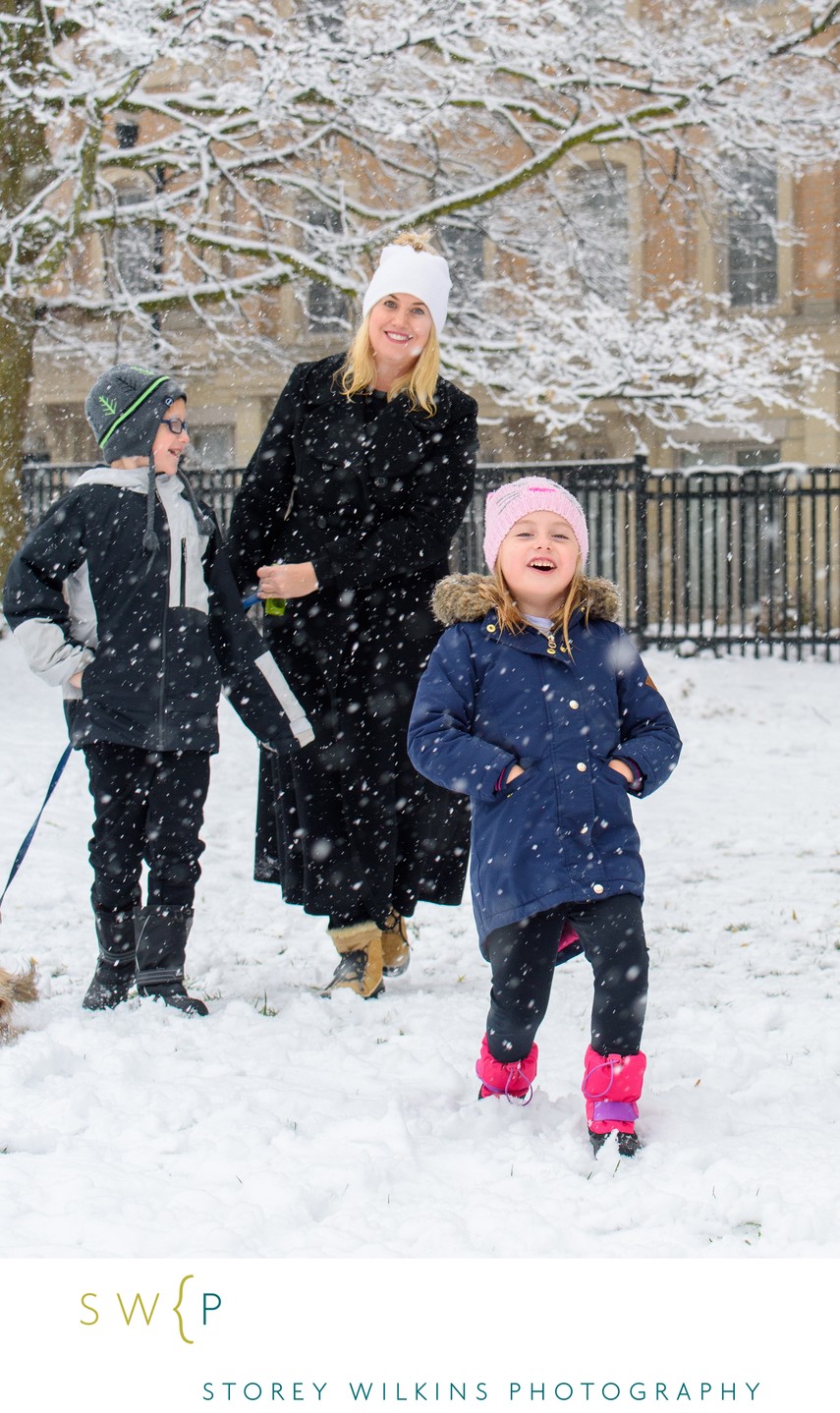 Mom Playing in Snow with Kids Portrait