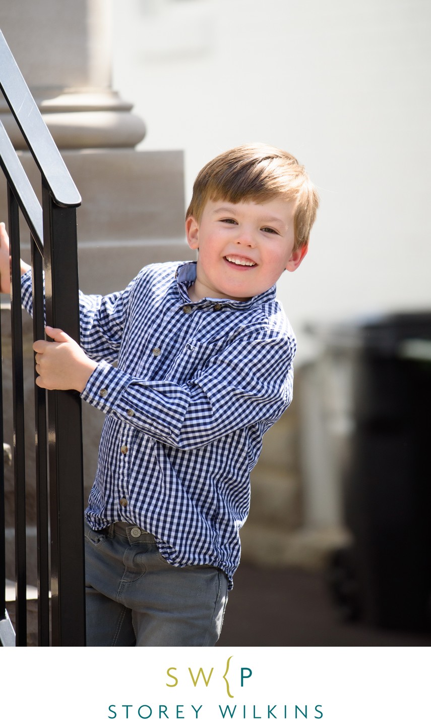boy on stairs during family portrait