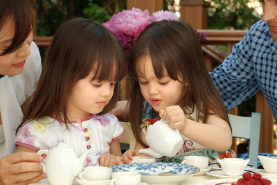 Backyard Tea Party: Twins Taking It Very Seriously