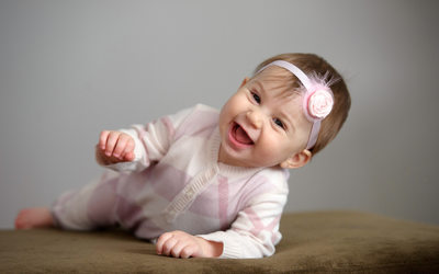 Baby Laughter on Ottoman: Nonstop Joy in Living Room