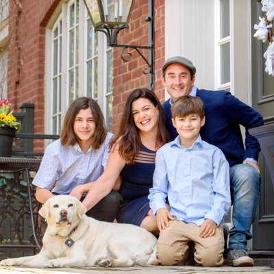 Family Portrait with White Lab at Home