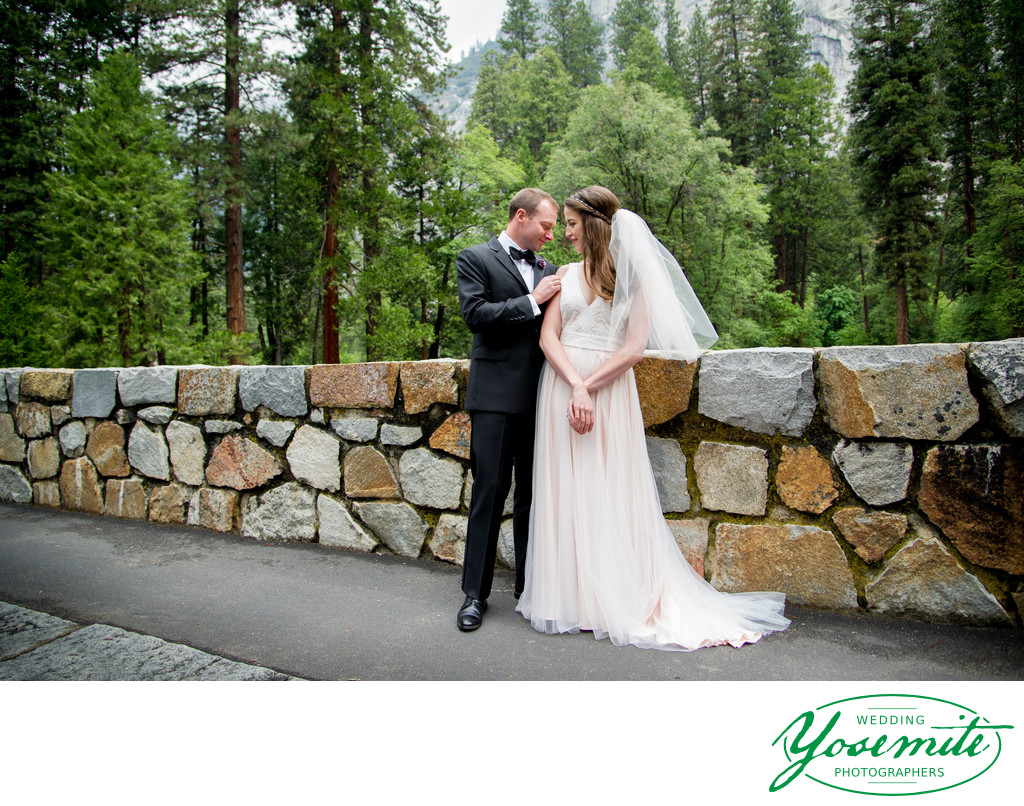 Bride And Groom On Bridge At Majestic Yosemite Hotel