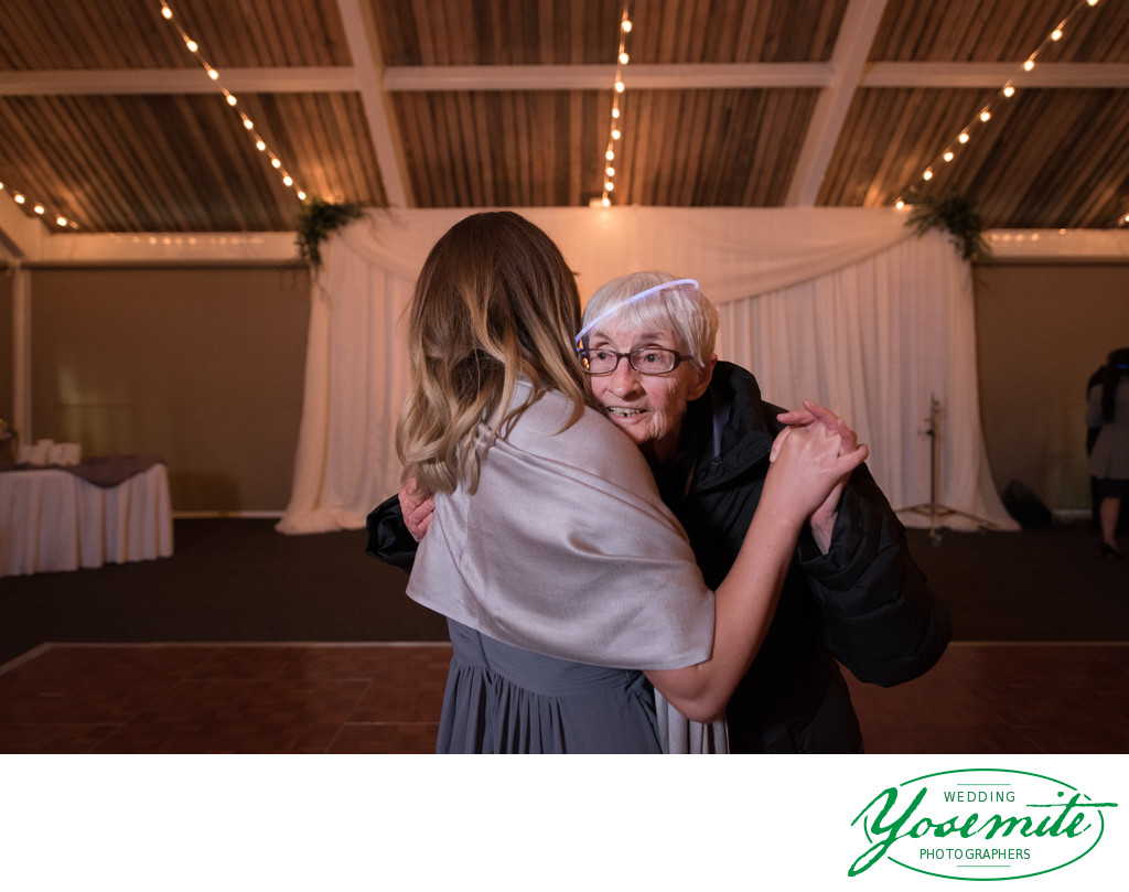 Bridesmaid Dances With Grandma Glow Stick On Her Head