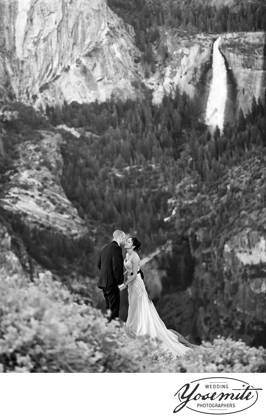 Couple at Glacier Point with Vernal Falls in the background