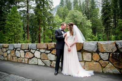Bride And Groom On Bridge At Majestic Yosemite Hotel
