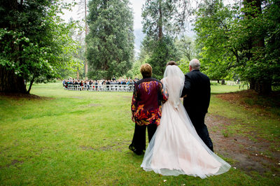 Bride Walks With Her Parents to Processional
