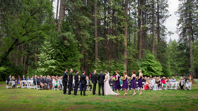 Wedding on the lawn in soft rain at majestic Yosemite Hotel