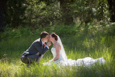 Yosemite Wedding Day: Tender Kiss Amidst Woodland
