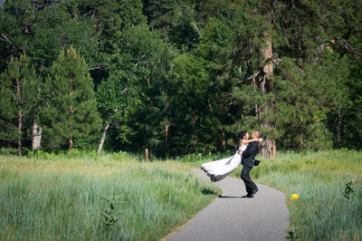 A Couple at Cook's Meadow the groom lifting the Bride.
