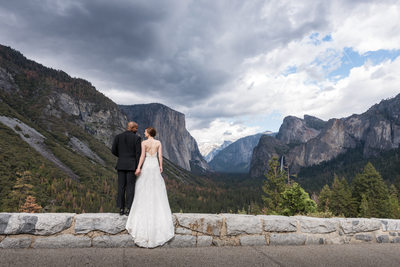 Bride And Groom Look Out Over Yosemite Valley