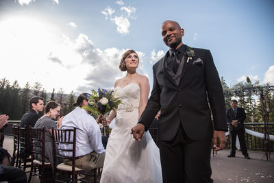 Bride Beams At Groom On Recessional At Tanaya Lodge Wedding