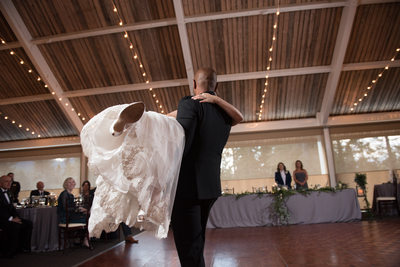 Groom Sweeps Bride Off Her Feet On Dance Floor at Tenaya Lodge