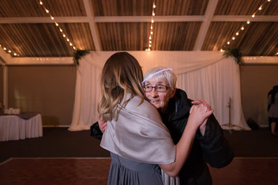Bridesmaid Dances With Grandma Glow Stick On Her Head