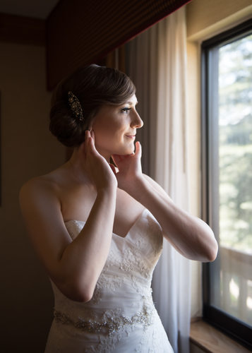 Bride Dresses At Window At Tenaya Lodge