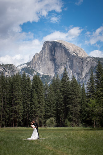 Bride And Groom On Wedding Day In Front of Half Dome
