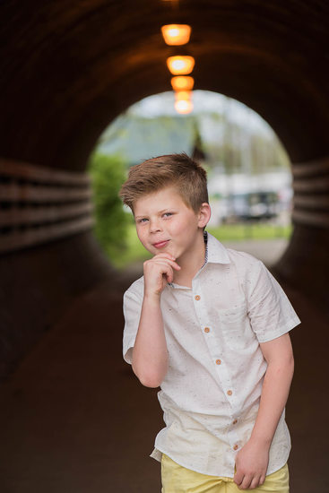 Fun, silly portrait of a boy near the Brentwood tunnels in Crockett Park