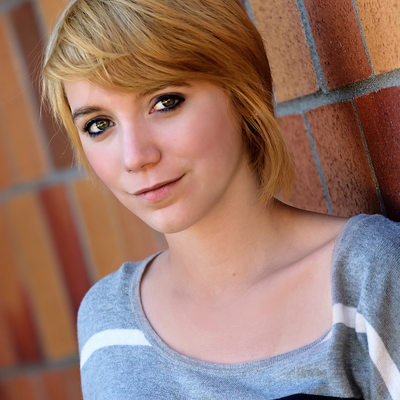 Senior portrait photo session brick wall background