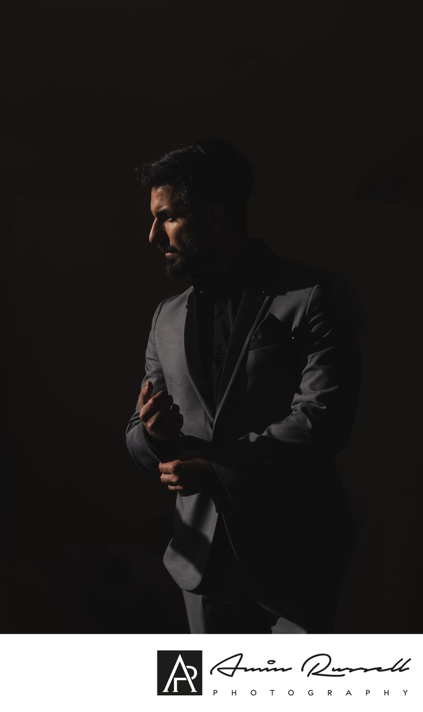 Dramatic groom prep at Newhall Mansion