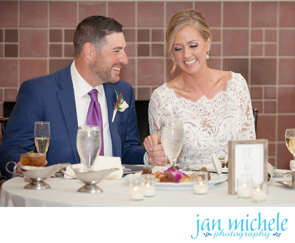 Couple sharing a smile over their first dinner as husband and wife