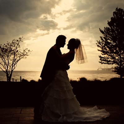 Sunset silhouette of a bride and groom