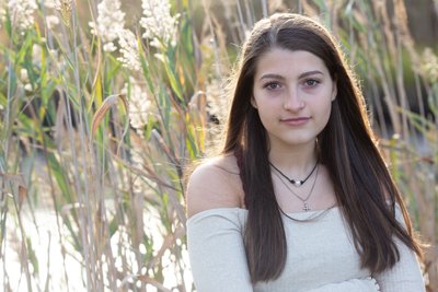 A senior portrait before and after taking in Gloucester Massachusetts with tall grass. Click here to see more before and after 