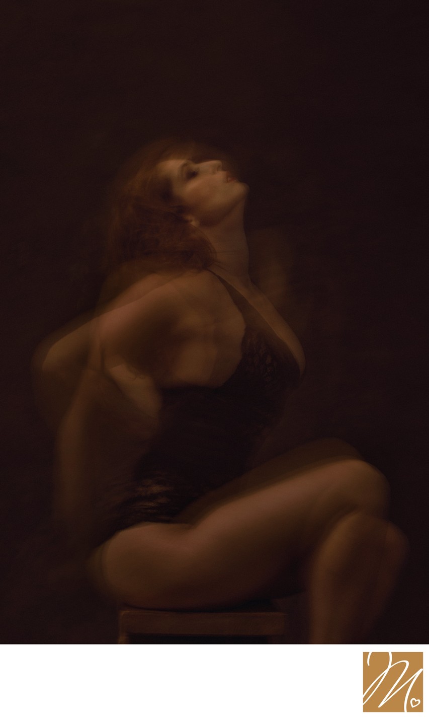 Boudoir Photographer Artistic Motion Portrait With Low-Key Lighting