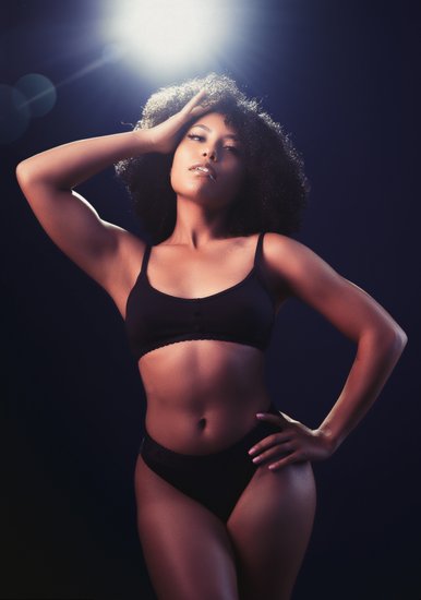 Boudoir Photographer Dramatic Studio Portrait With Backlight and Strong Pose