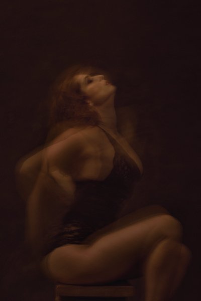Boudoir Photographer Artistic Motion Portrait With Low-Key Lighting