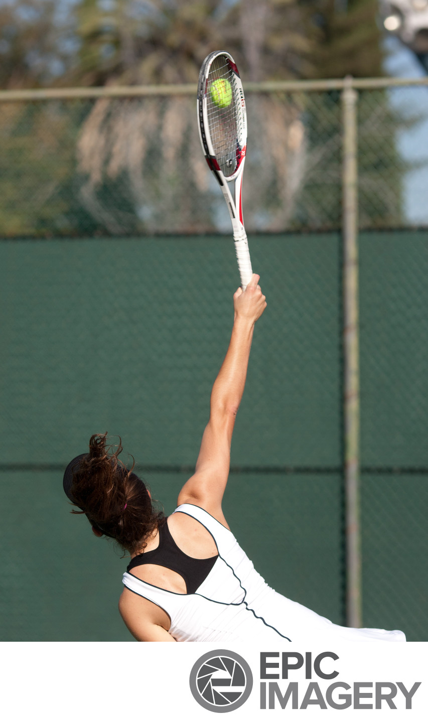 High School Tennis Athlete Serving  