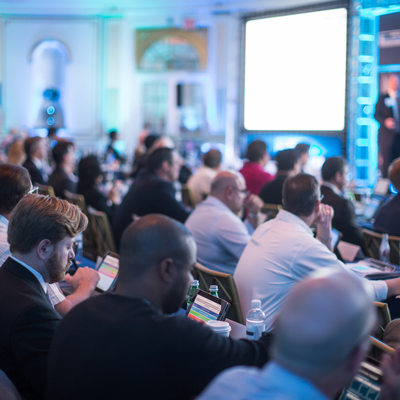 Attendees at a Due Diligence Symposium Taking Notes