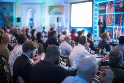 Attendees at a Due Diligence Symposium Taking Notes