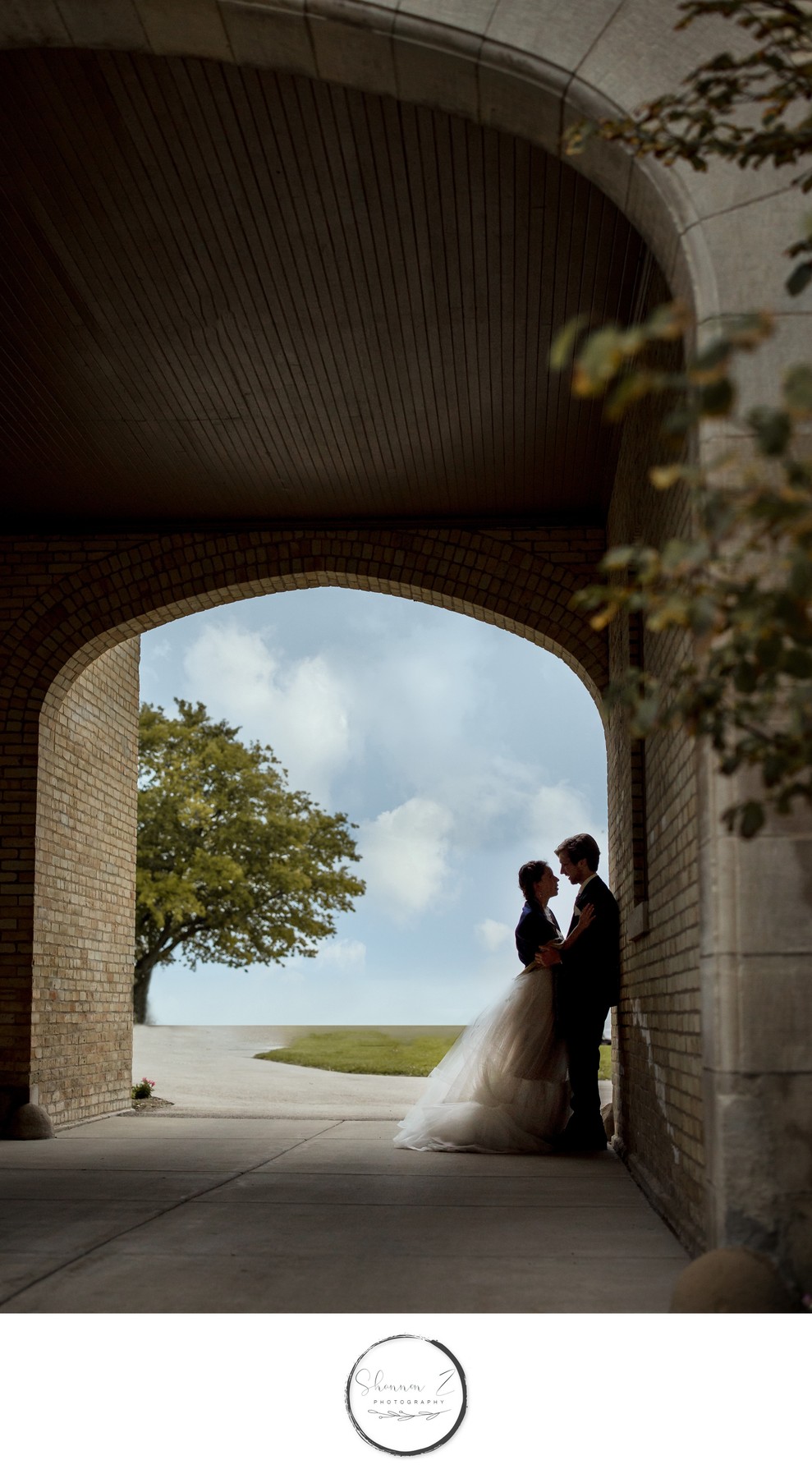 Silhouette: Bride and Groom by the Lake