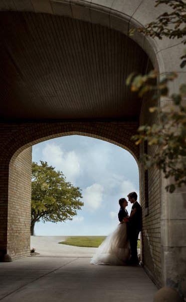 Silhouette: Bride and Groom by the Lake