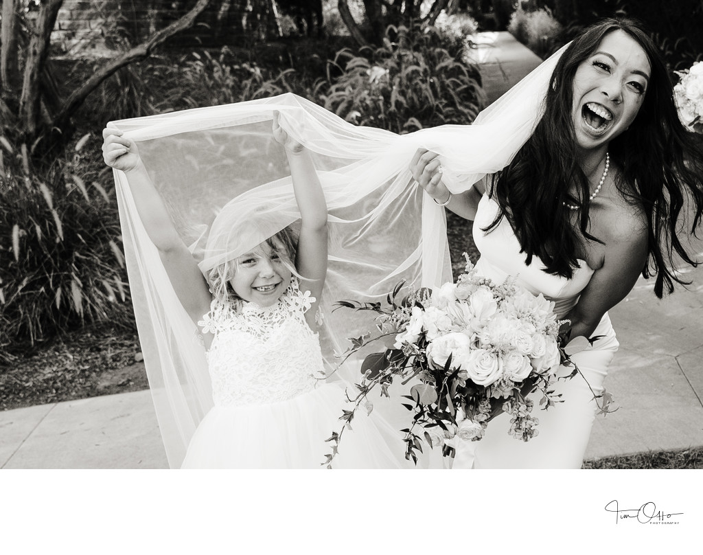 Candid photo of bride and flower girl Estancia Wedding.